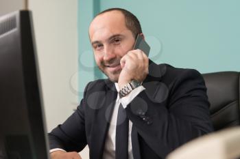 Happy Young Business Man Work In Modern Office On Computer