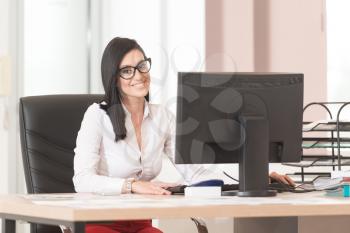 Portrait Of A Cheerful Casual Businesswoman Smiling