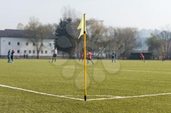 Sport and Game Concept - Close Up of Football Field Corner With Flag Marker