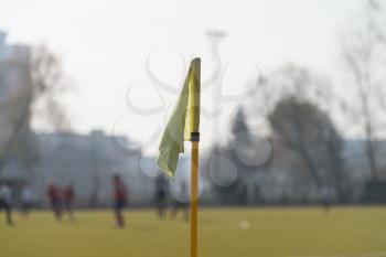 Yellow Flag in Corner of Football Playground - Lazy Wind Blowing