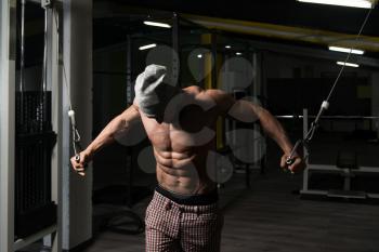 Man In The Gym Exercising On His Chest With Cable Crossover In Gym