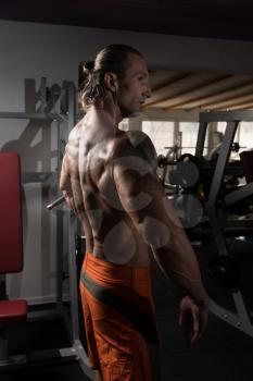 Handsome Mature Man Standing Strong In The Gym And Flexing Muscles - Muscular Athletic Bodybuilder Fitness Model Posing After Exercises