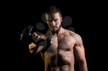 Muscular Model Doing Heavy Weight Exercise For Shoulder With Dumbbells On Black Background