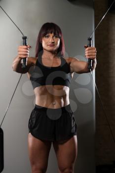 Young Woman Is Working On Her Chest With Cable Crossover In A Modern Fitness Gym