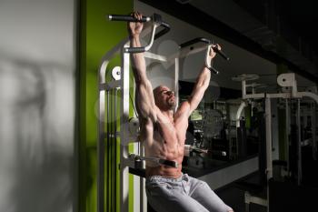 Man Performing Hanging Leg Raises Exercise - One Of The Most Effective Ab Exercises