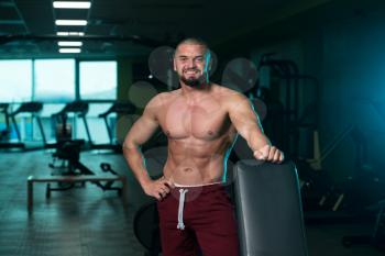 Handsome Good Looking And Attractive Young Man With Muscular Body Relaxing In Gym