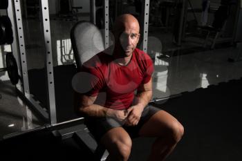 Man Working Out Biceps In A Gym - Dumbbell Concentration Curls