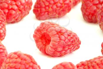Ripe raspberry on a white background