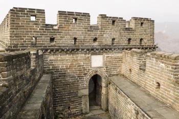 Small doorway leading into building on top of Great Wall located in Mutianyu China