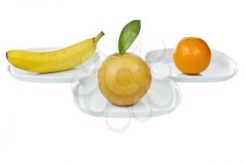 Variety of whole fruit in each plate on white background