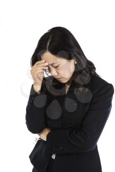 Mature Asian Woman displaying major stress on white background