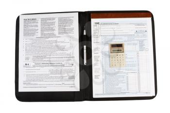 Horizontal photo of United States Tax Form 1040, for Individual Income, with Calculator and pen lying on nylon business folder isolated on white 