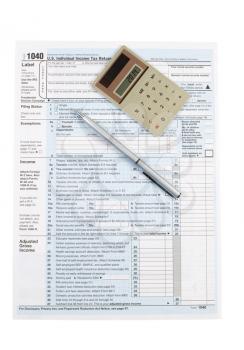 Vertical photo of United States Tax Form 1040 for Individual Income with Calculator and pen isolated on white 