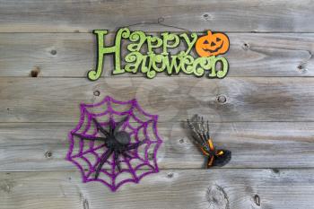 Top view of Halloween objects on rustic wood