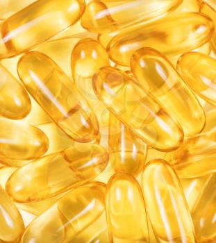 Close up of fish oil capsules in filled frame format 