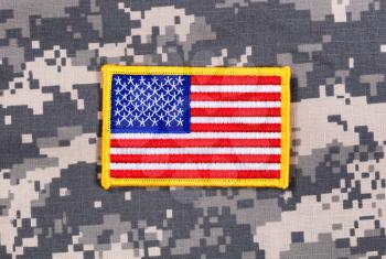 USA flag patch with yellow trim on military battle dress uniform. 