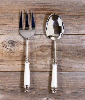Overhead view of a large fork and spoon for serving food 