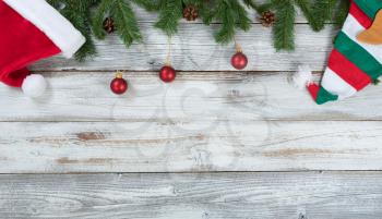 Top border of Christmas decorations on rustic wood 