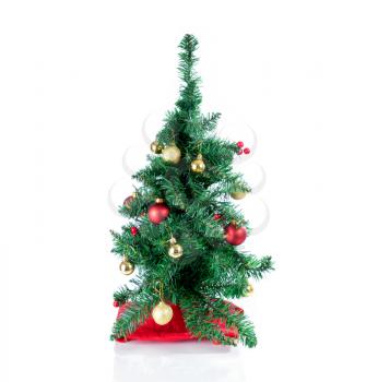 Christmas tree with decorations isolated on white with reflection 