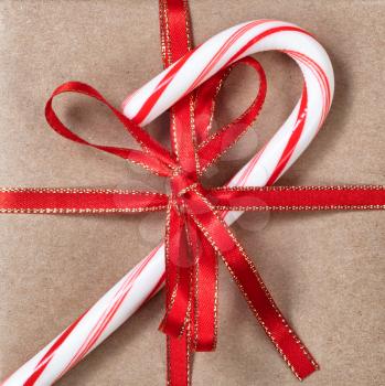 Filled frame background of Christmas gift box and candy cane  