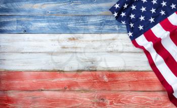 United States flag on red, white and blue rustic wooden boards with plenty of copy space 