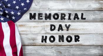 Waving United States Flag on left side of white rustic wooden with large text for Memorial Day with honor Background  