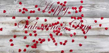 Little red lovely hearts on white rustic natural wood in flay lay composition for a happy Valentines Day concept