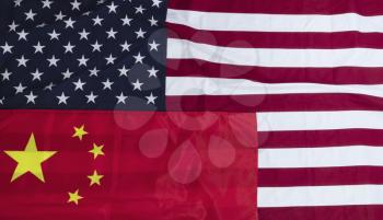 Waving cloth US and Chinese flags for the Trade War Concept 