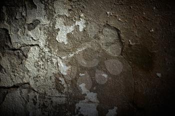 Grunge cement wall with dramatic light