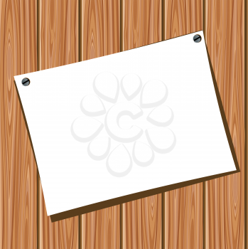White blank paper on a wooden wall