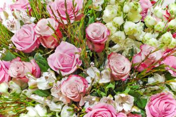 colorful floral bouquet of roses, lilies and orchids arrangement centerpiece