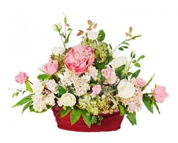 Colorful floral bouquet from roses and cloves arrangement centerpiece in vase isolated on white background