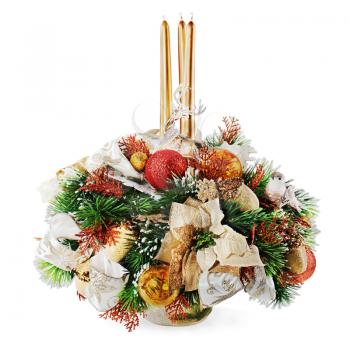Christmas arrangement of Christmas balls, snowflakes, candles , beads and pine branches in vase isolated on white background