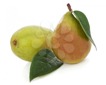Ripe pears with green leaves isolated on white background. Closeup.