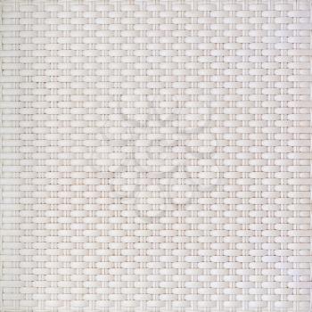 White cream plastic surface with a repeating pattern. For use as background.