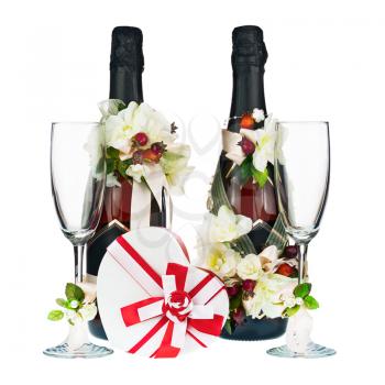 Champagne Bottle and Glass with Wedding Decoration of Flower Arrangements Isolated on White Background.
