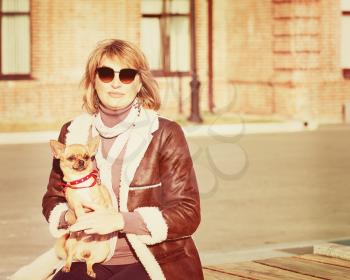 Cute Woman and Her Chihuahua Dog on Nature Background. With Retro Vintage Instagram Filter