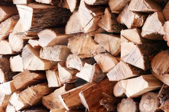 Woodpile from dry oak logs. Selective focus.