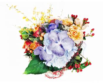 Colorful floral arrangement of roses, lilies, freesia, orchids and irises isolated on white background.
