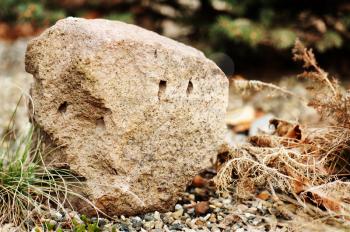 Beautiful granite stone in the garden for meditation. Closeup.