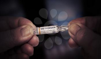 KYIV, UKRAINE-DECEMBER, 2019: Injection of Metformin. Ampoule in a Hands of an Elderly Old Man. Health Care of Older People. Close Up View.