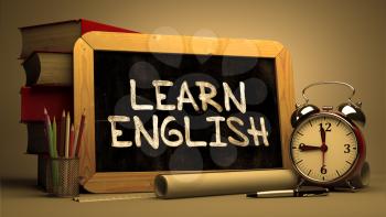 Learn English Concept Hand Drawn on Chalkboard. Blurred Background. Toned Image.