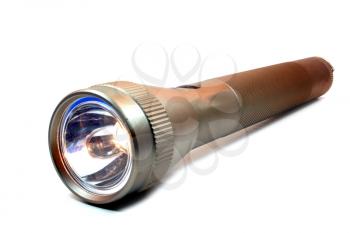 Metal flashlight isolated on a white background
