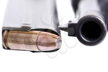 Macro shot of 9mm bullets and a Luger gun barrel