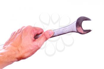 Hand holding a combination wrench isolated on white