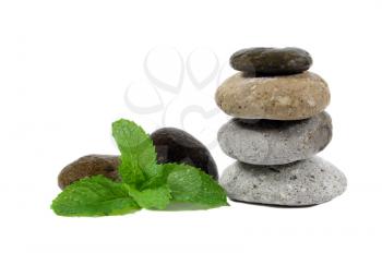 Zen stones and mint leaves isolated on white