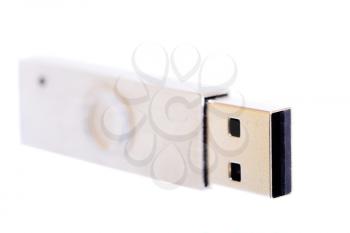 Macro shot of a  stainless steel USB stick isolated on white