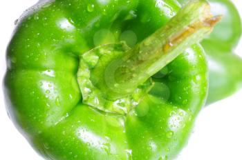  Two green peppers on white