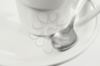 White coffeemug and spoon