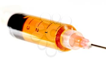 Macro shot of a plastic syringe isolated on a white background